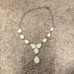 Reversible white and burnt orange necklace.